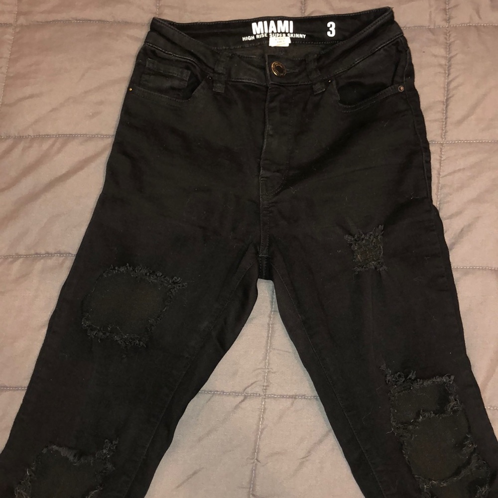 Ripped high rise skinny jeans